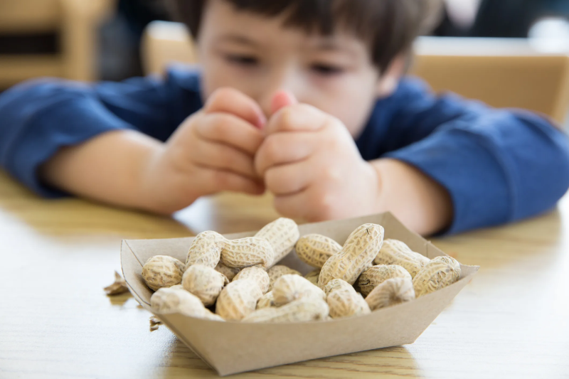 Child reacting to common food allergies affecting kids