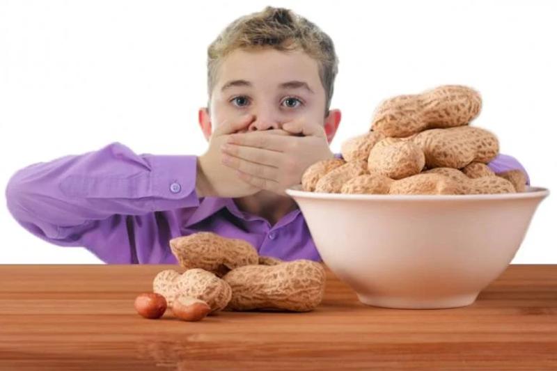 Child reacting to common food allergies affecting kids