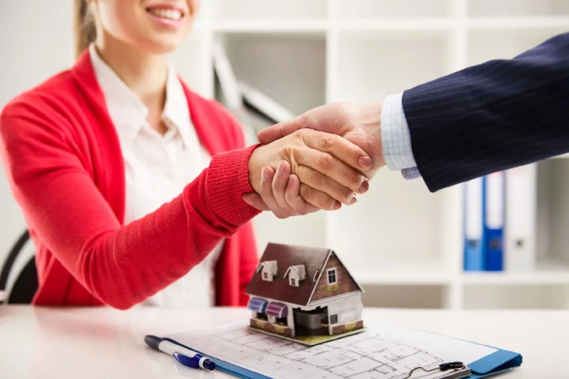 Small business owner reviewing documents to get a business loan.